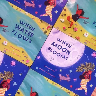 Children's books with vibrant covers featuring nature and playful illustrations