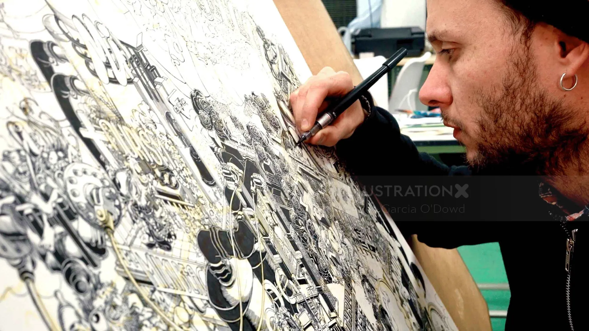 Artist Carles Garcia O'Dowd drawing detailed black and white illustration with pen