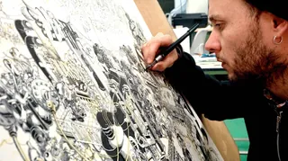 Artist Carles Garcia O'Dowd drawing detailed black and white illustration with pen