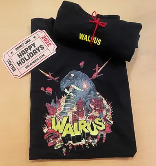 Black Walrus t-shirt with colorful graphic and holiday tickets by Carles Garcia O'Dowd