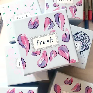 Stacked fresh boxes with pink floral petal design by Caroline So
