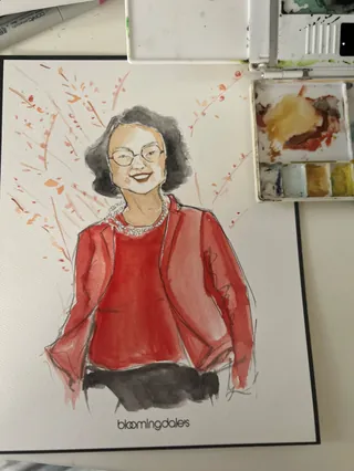 Watercolor portrait of woman in red jacket wearing glasses by Caroline So