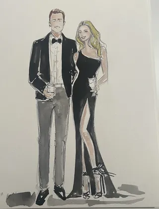 Man and woman in formal attire holding glasses of drinks