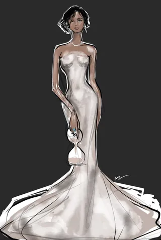 Woman wearing a white mermaid gown holding a small purse