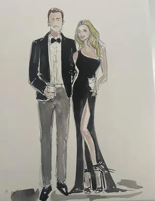 Man in tuxedo and woman in black dress holding drinks