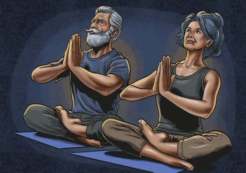 Elderly couple sitting cross-legged, meditating with hands in prayer