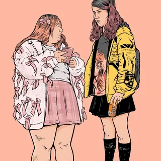 Two young women talking, one holding a cup, wearing trendy clothes