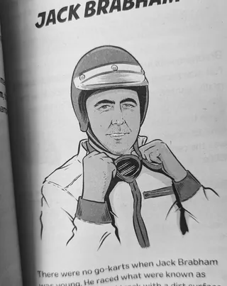 Portrait of Jack Brabham wearing racing helmet and suit