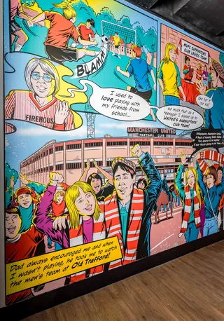 Colorful comic mural showing Manchester United women's team history