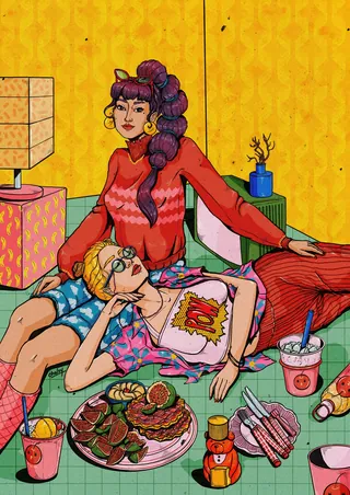 Two people relaxing with food and drinks on a colorful floor by Chelsy Escalona