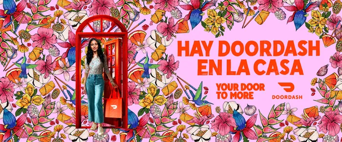 Woman in red phone booth with floral background and DoorDash ad