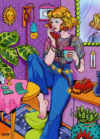 Woman in colorful room holding a candle with tarot cards nearby