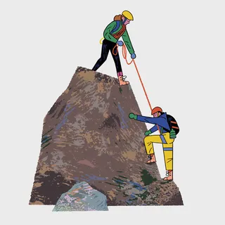 Rock climbing on a steep cliff in the outdoors