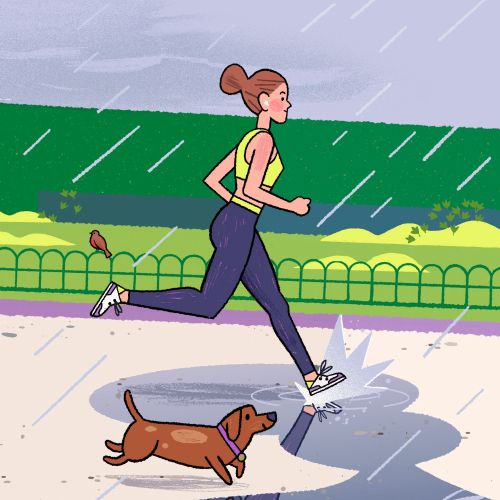 Runner jogging through the rain on a cloudy day