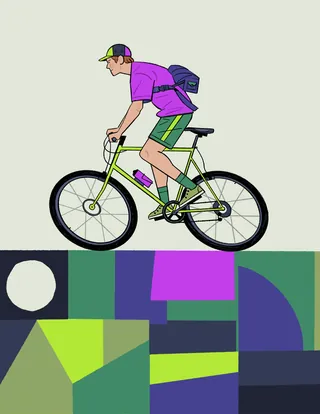Young man riding a bicycle with colorful abstract background