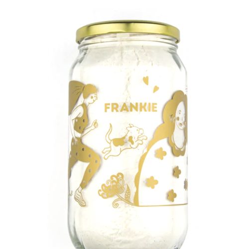Glass jar with gold line art illustrations of people and animals by Chrissy Lau