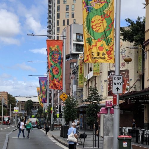 Colorful Year of the Dragon flags hanging on street poles