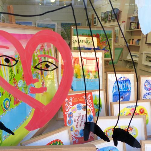 Abstract artwork featuring a pink heart and eyes in a colorful setting