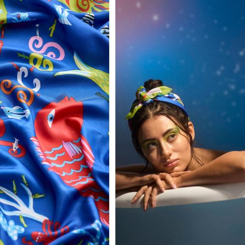 Woman wearing colorful sea-themed headscarf leaning on bathtub edge