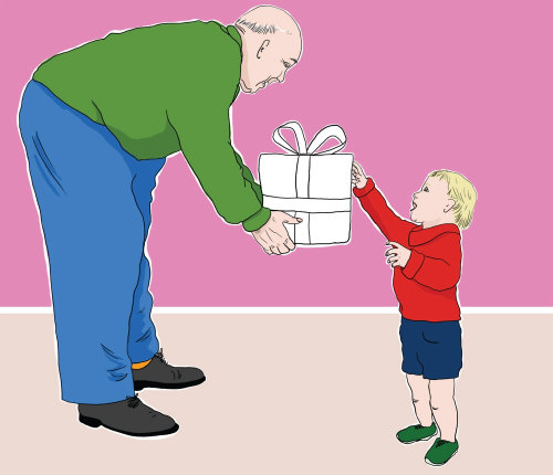 Grandfather presenting gift to grandson