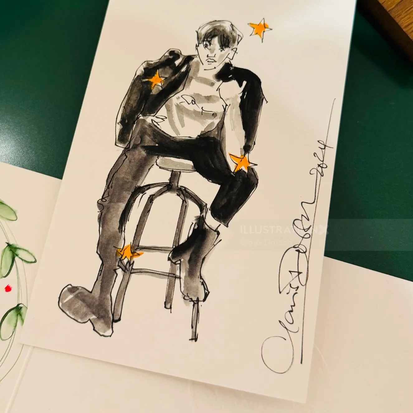 Sketch of a person sitting on a stool with orange stars