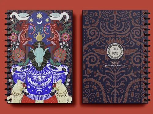 Carnet à spirale illustré de Coty Borio, avec une couverture avant mystique et une couverture arrière ornée de motifs.