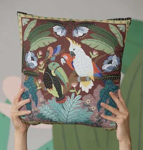 Coty Borio cushion featuring colorful tropical birds and lush foliage