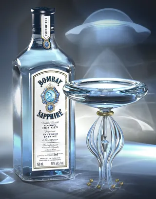 Bottle of Bombay Sapphire Gin with elegant glass and vapor smoke