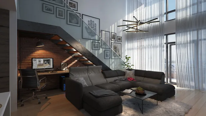 Modern living room with dark sectional sofa and decorative staircase