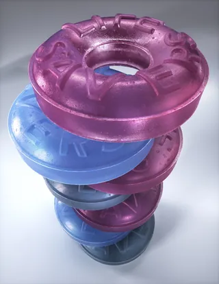 Stacked colorful Lifesavers candy rings in purple, blue, and pink