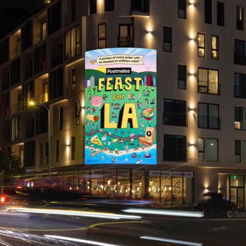 Postmates Feast for LA colorful mural on building at night