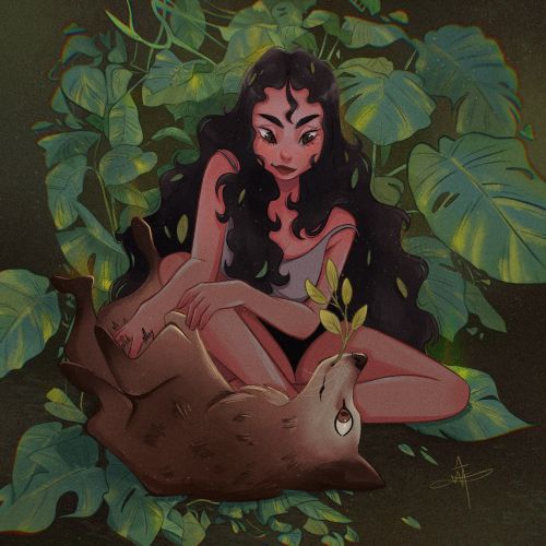 Woman with long hair sitting with an animal in lush green foliage
