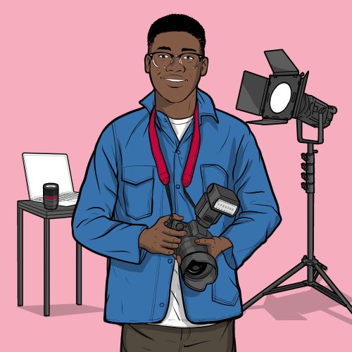 Photographer holding camera with studio lights and table in background by Davi Augusto