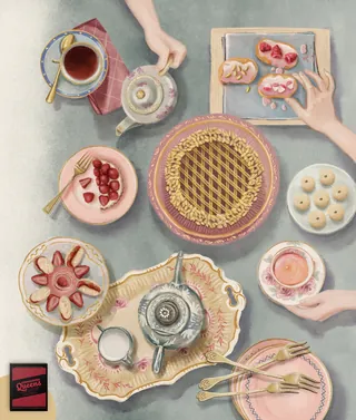 Overhead view of tea set and pastries on table by Debora Islas