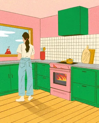 Woman standing in a kitchen with green cabinets and pink stove by Debs Lim