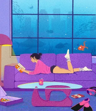 Woman reading on couch with aquarium background by Debs Lim