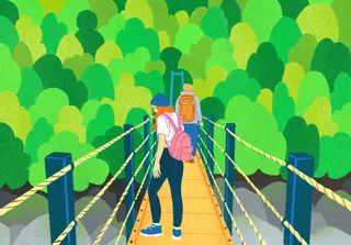 People crossing a suspension bridge surrounded by green forest by Debs Lim