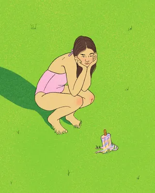 Girl crouching on grass watching melting popsicle by Debs Lim