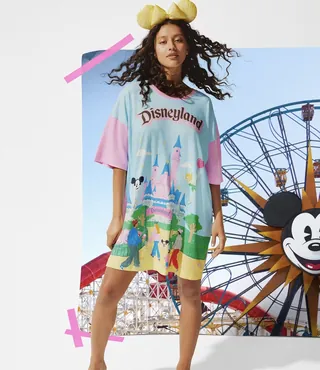 Model in Disneyland dress with Mickey Ferris wheel background by Debs Lim