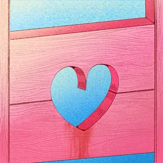 Blue heart-shaped cutout on pink wooden surface with sky background