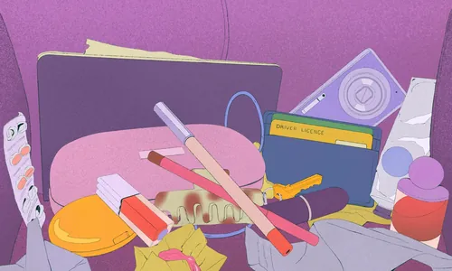 Inside handbag showing cosmetics and stationery by Debs Lim
