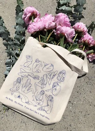 Illustrated tote bag design promoting women’s rights movement