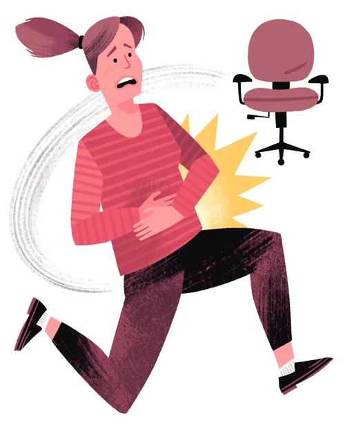 Woman clutching stomach in pain near empty office chair