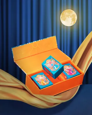 Orange box with three tarot cards and full moon in the background
