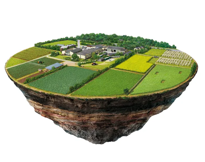 Model of floating agricultural island with fields and buildings by Eberhard Reimann