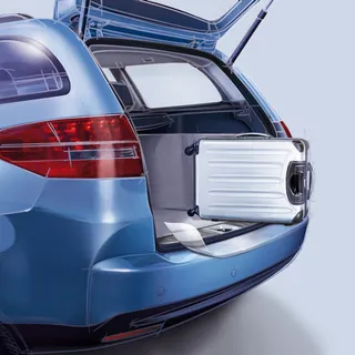 Car trunk with retractable luggage inside by Eberhard Reimann