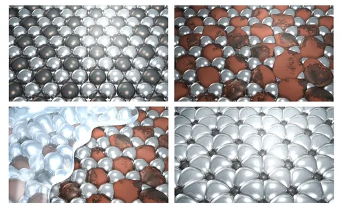 Metal spheres showing rust, paint, and reflections by Eberhard Reimann