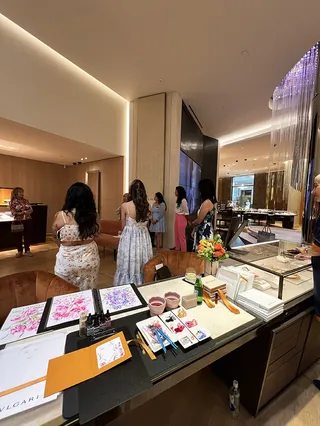 Women at Bulgari Mother's Day event in a stylish interior setting