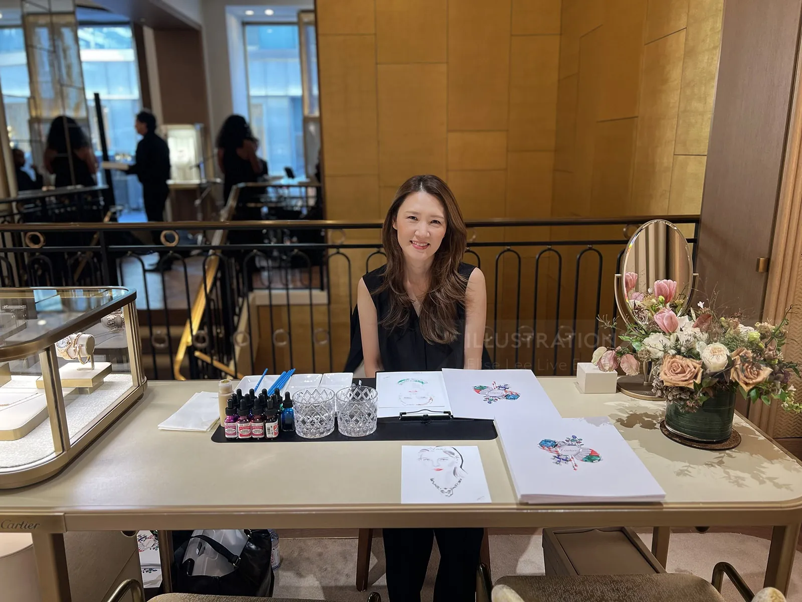 Artist Elise Lee drawing live illustrations at Cartier event