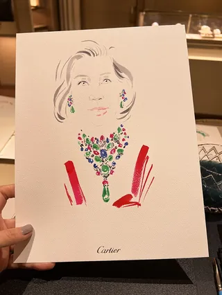 Illustration of a woman wearing colorful Cartier jewelry including a necklace and earrings